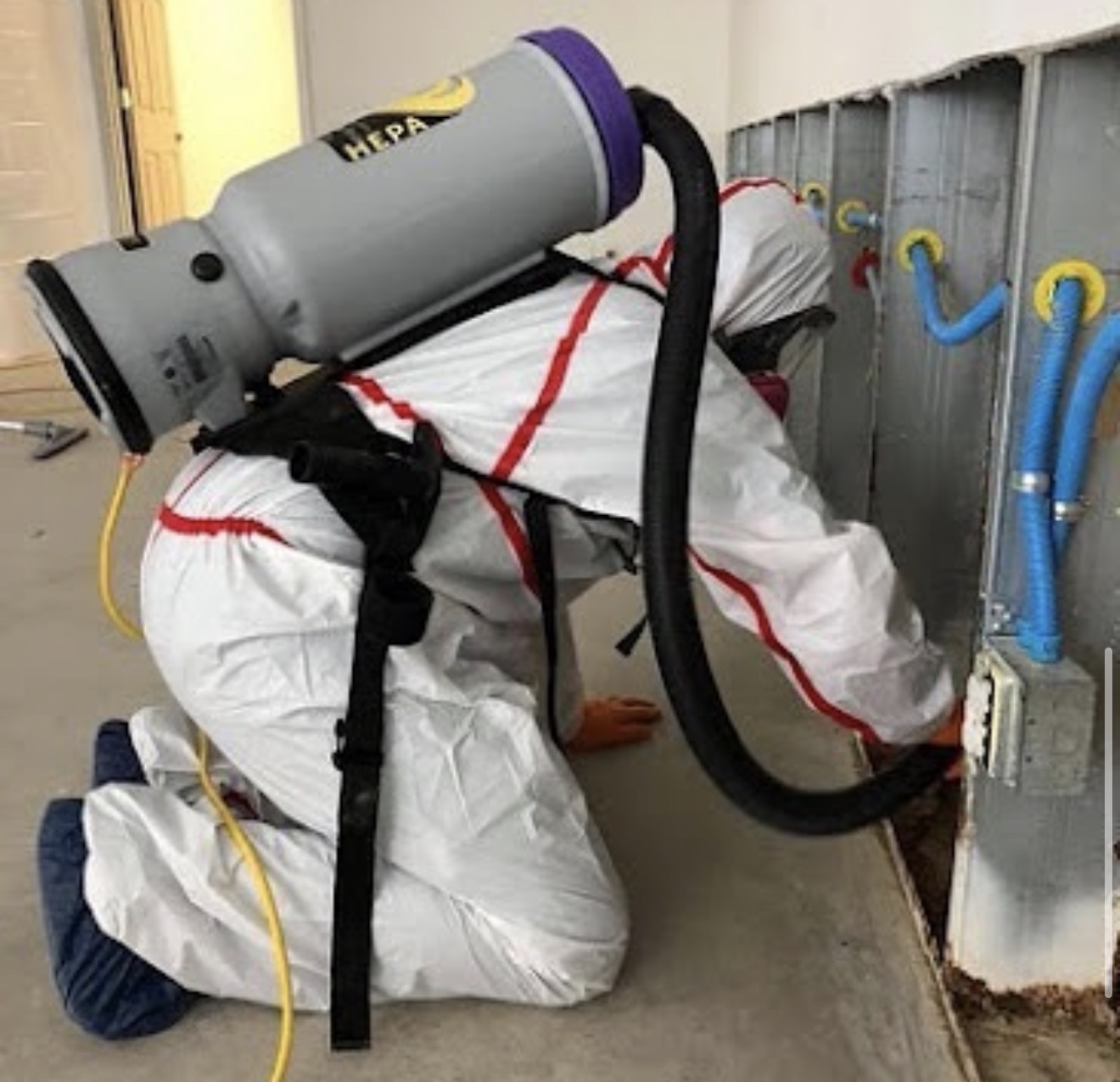 HEPA vacuum extraction during a structural fire and smoke odor remediation project.