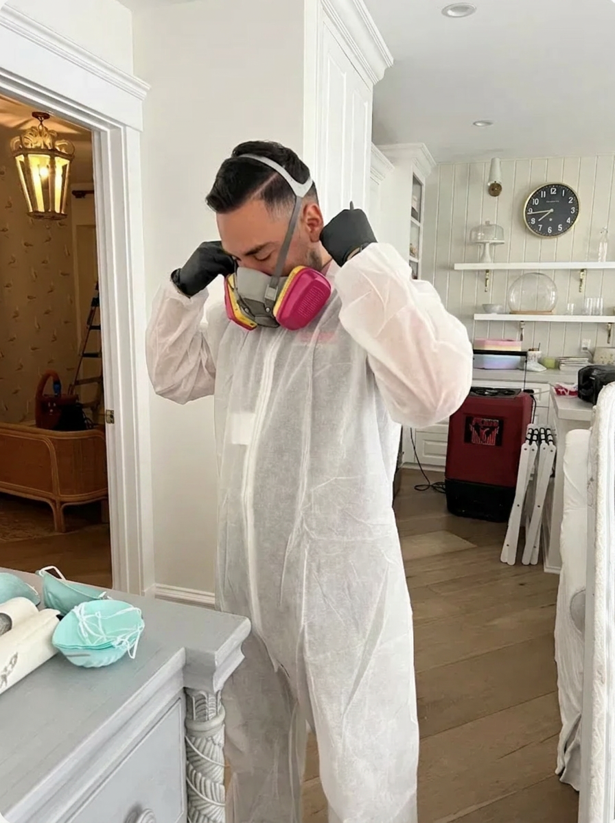 Odor Removal Services Denver technician suited up for a Denver odor remediation job.